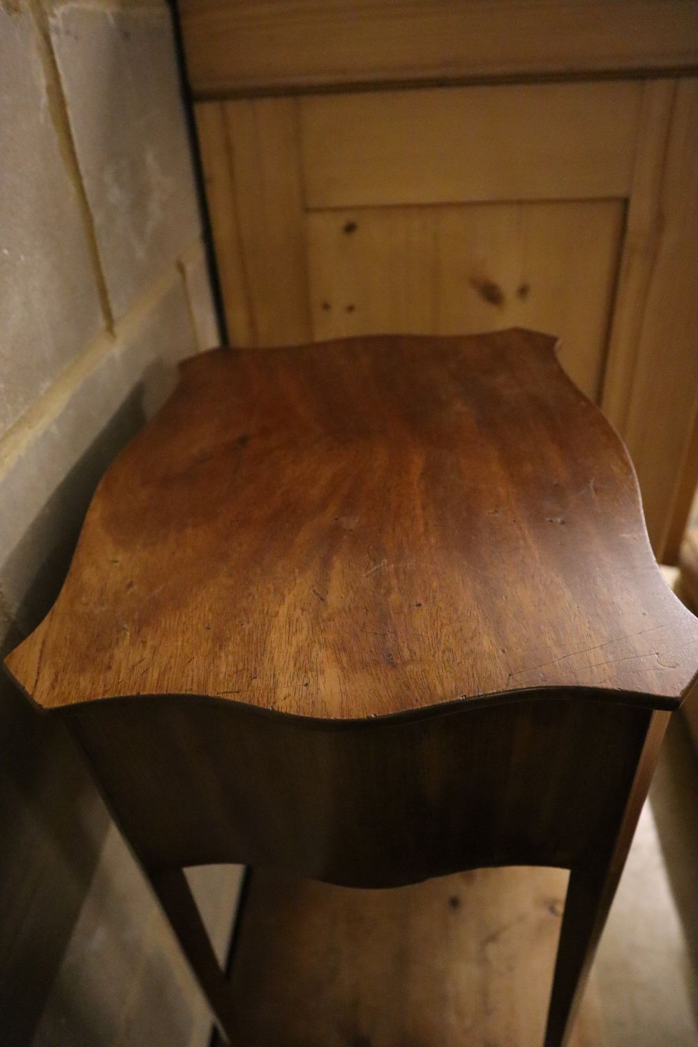 A small 19th century serpentine mahogany side table fitted two drawers, width 42cm depth 33cm height 70cm